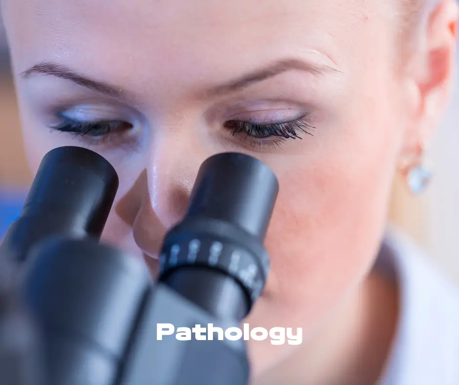 Woman looking through microscope